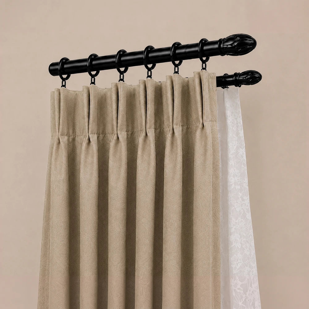 16mm curtain rod rings on a black rod with beige drapery panels, metal ring attachments and a classic header style.