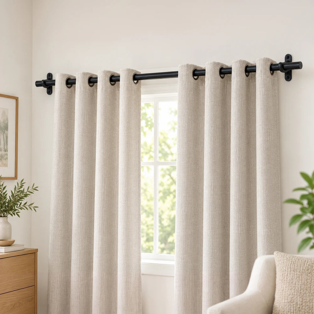 16mm Poly Bracket curtain rod with beige textured curtains hanging beside a window, featuring black metal hardware.