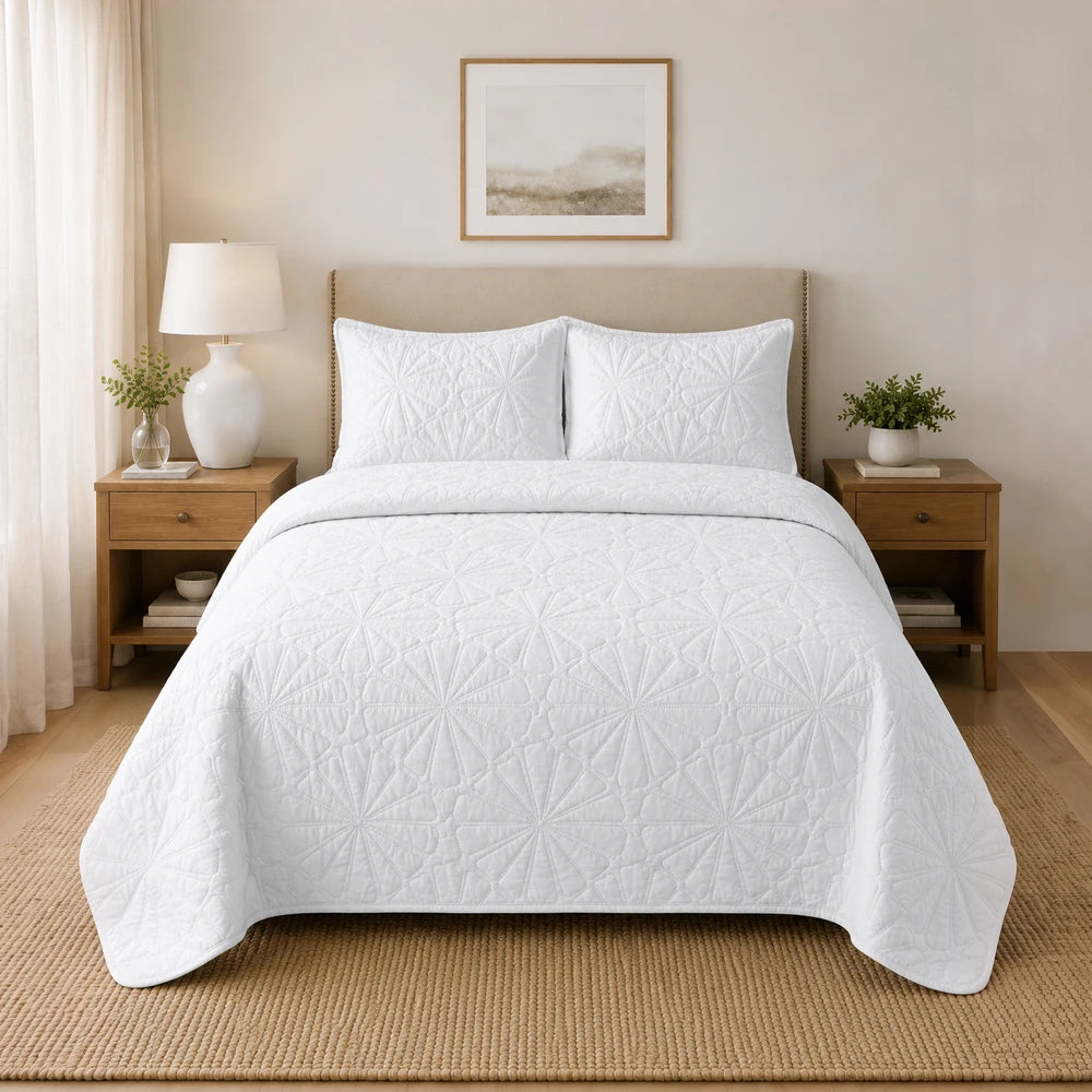 3Pc Pierre Cardin Pinsonic Quilt in white with a geometric quilted pattern on the bed.