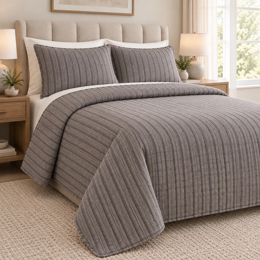 3Pc Pierre Cardin Textured Pinsonic Quilt in grey striped fabric with matching shams for a coordinated bedroom look.