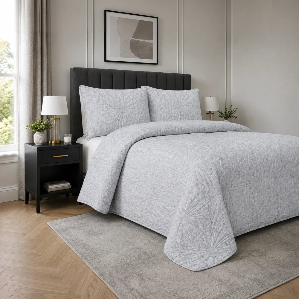 3pc Pierre Cardin Textured Pinsonic Quilt set in light gray with a geometric starburst pattern, perfect for a modern bedroom.