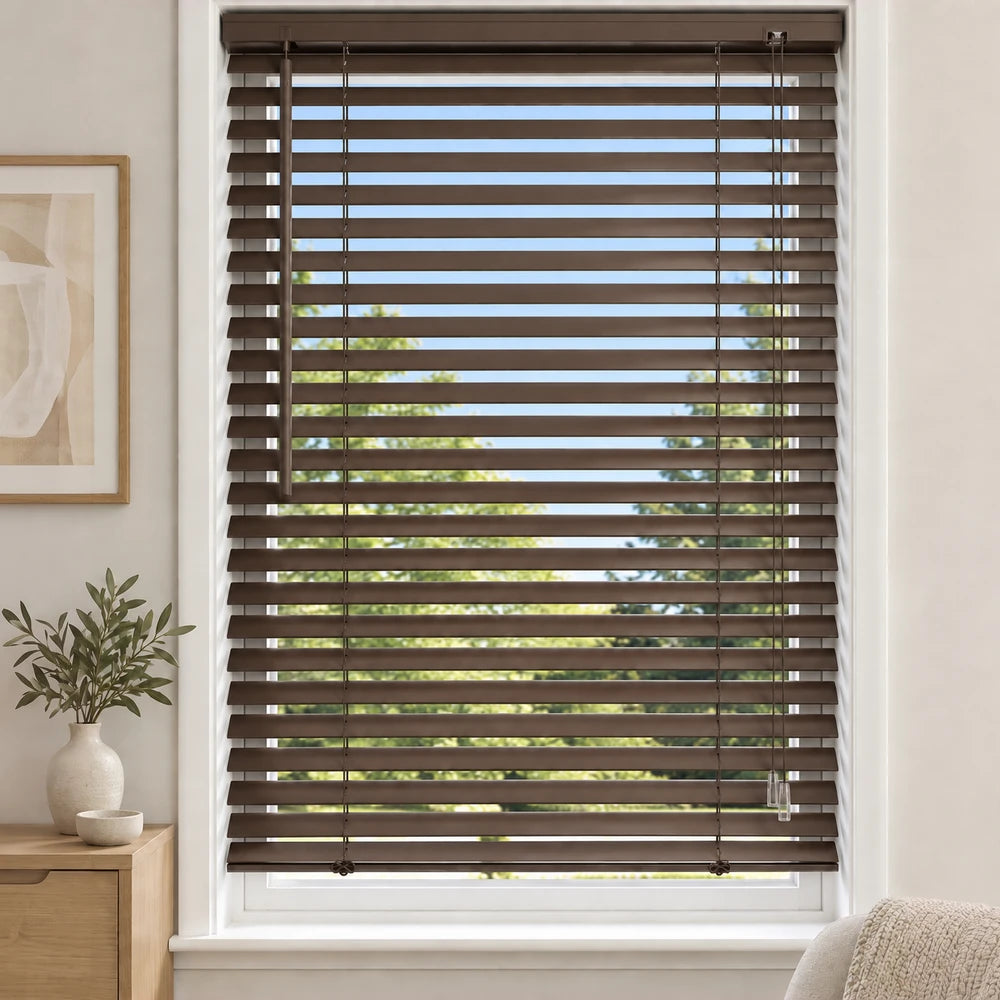 Aluminium blinds in dark brown finish mounted on a window, featuring adjustable horizontal slats and pull cords.