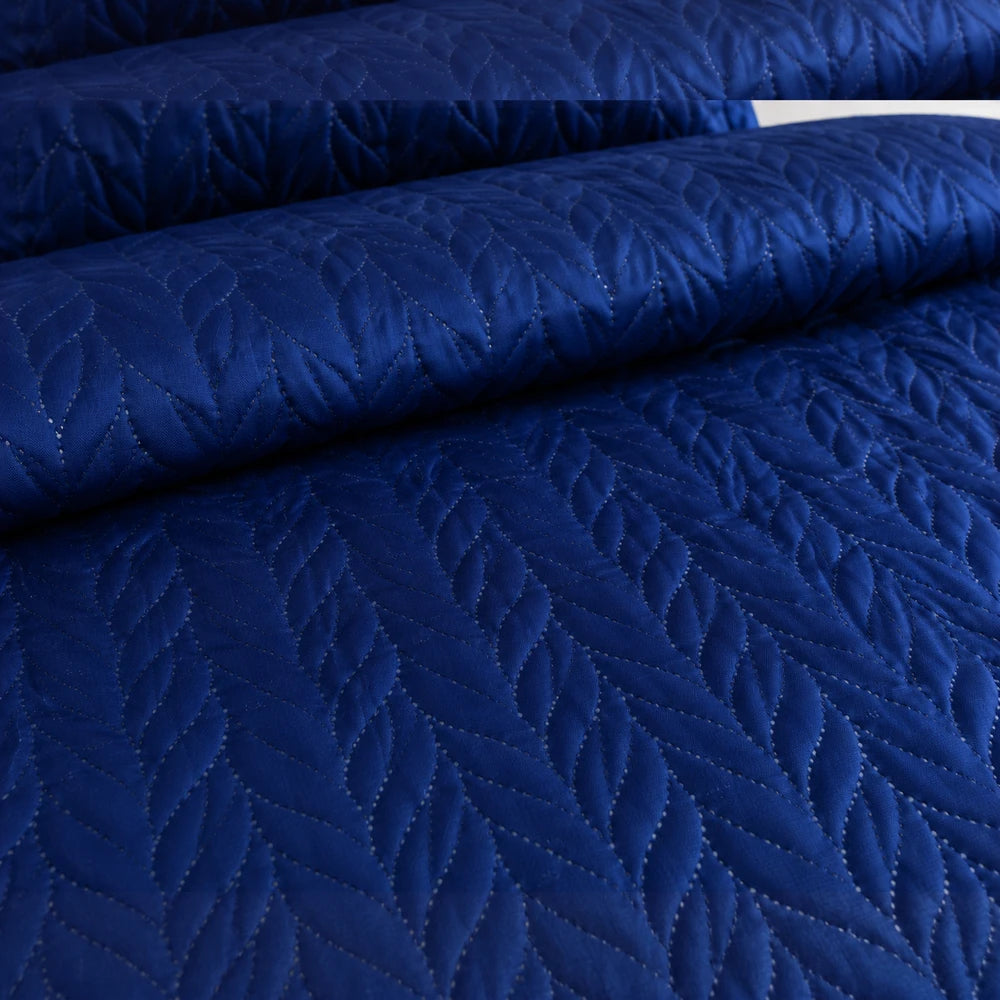 Blue 3pc ultrasonic satin quilt set featuring a quilted leaf pattern, rich navy color, and smooth satin finish.