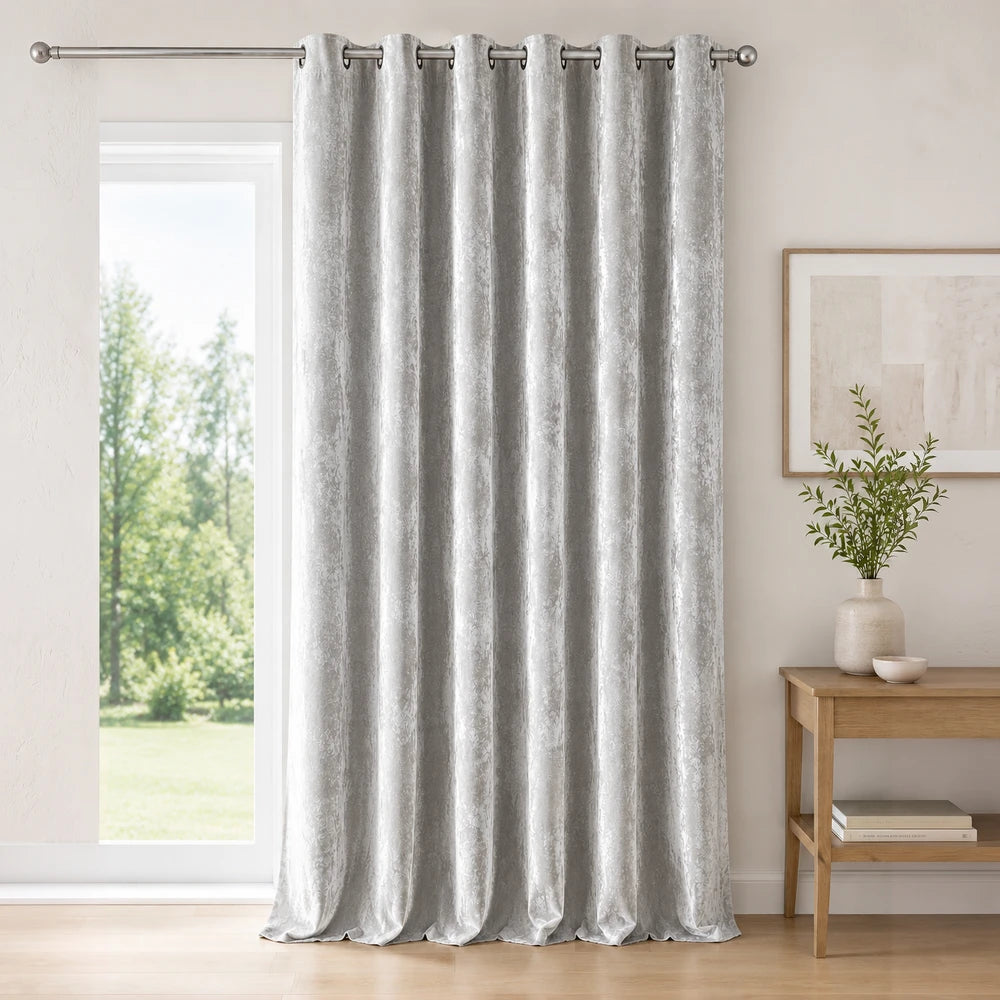 Carducci Abstract Velvet Unlined Eyelet Curtain in silver-gray with a subtle textured pattern and elegant drape.