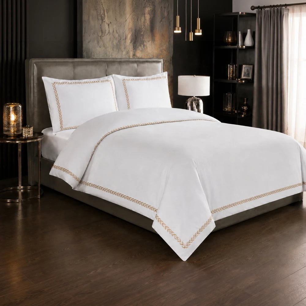 Carducci Serenity 100% cotton bedding in pure white with a gold braided border on the duvet cover and pillow shams
