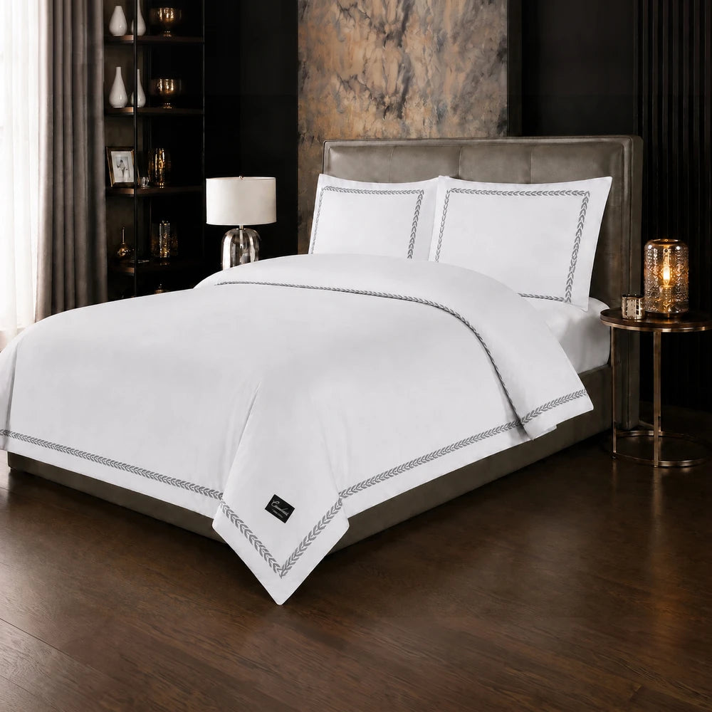 Carducci Serenity 100% cotton bedding in pure white with a silver grey braided border on duvet cover and pillowcases.