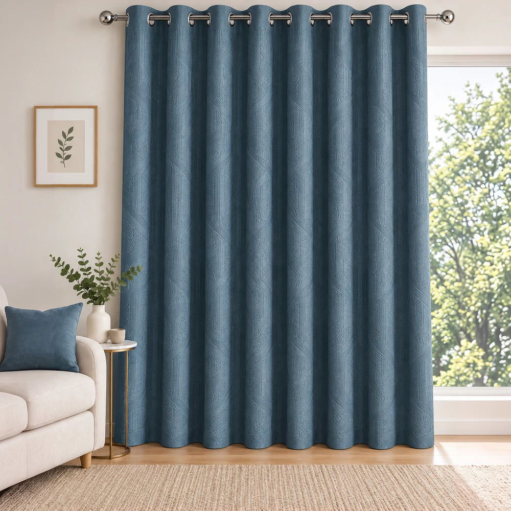 Carducci velvet textured unlined eyelet curtain in blue, adding rich color, soft drape, and a refined look to living spaces.