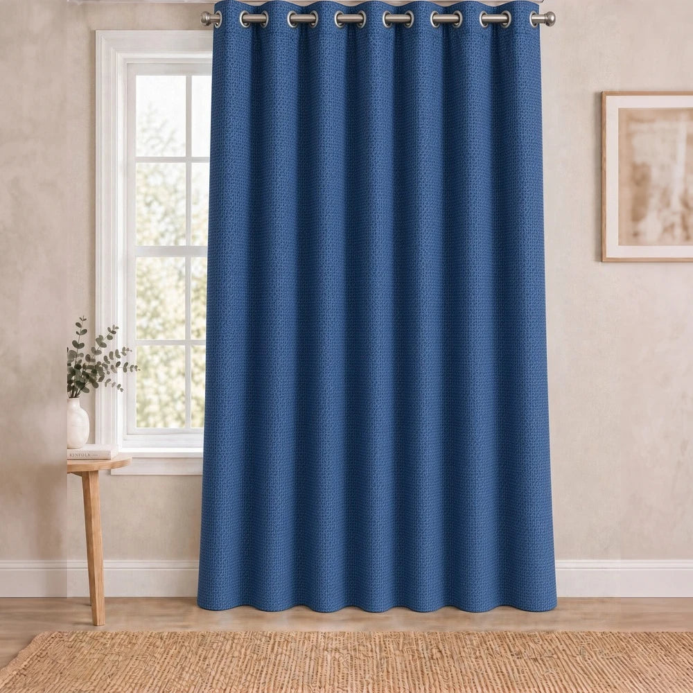 Charlie Textured Eyelet Lined Curtain in blue with a subtle weave pattern and metal grommet header for easy hanging.