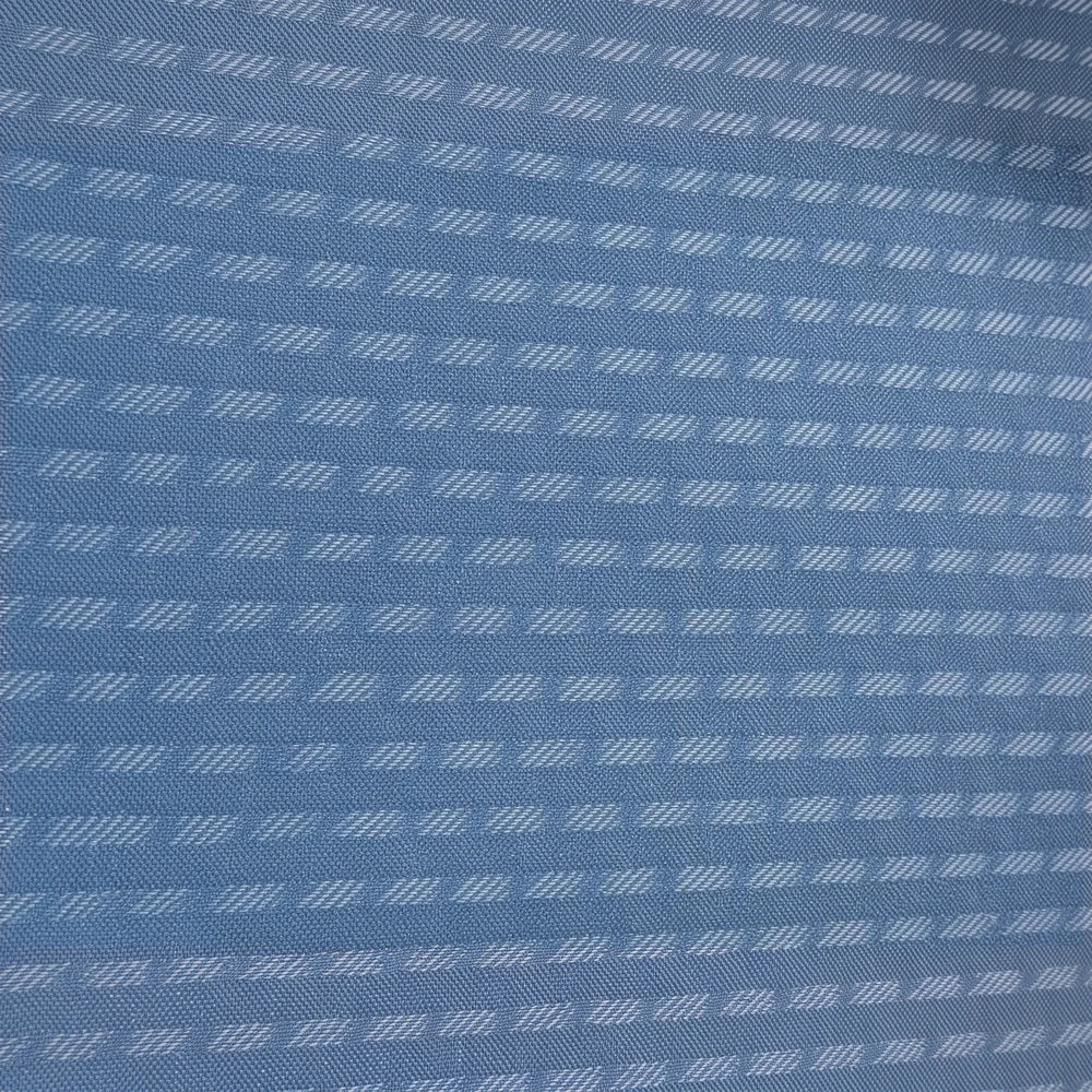 Charlie Textured Eyelet Lined Curtain in blue with woven diagonal eyelet pattern for a decorative, light-diffusing window