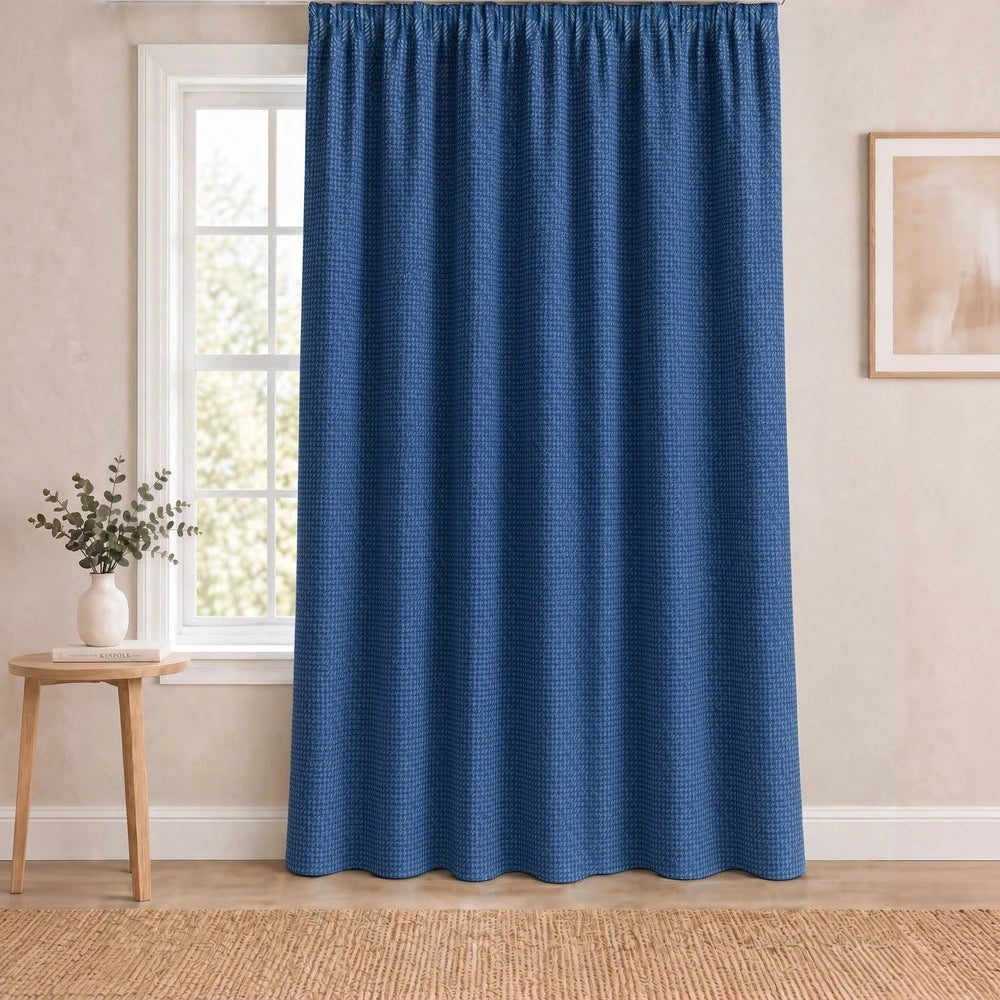 Charlie Textured Taped Lined Curtain in blue with a subtle woven pattern and full-length drape.