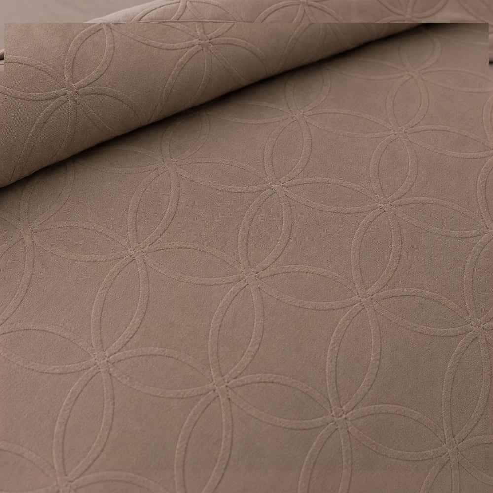 Cotton Co Ashley Duvet Cover Set in Stone featuring a subtle circular quilted pattern on soft cotton fabric.