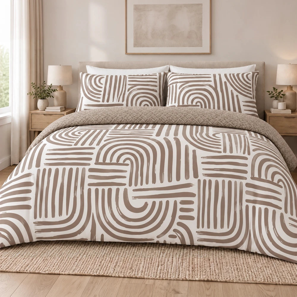 Cotton Co Zaria duvet cover set in white with taupe geometric print and matching shams for a neutral bedroom look.