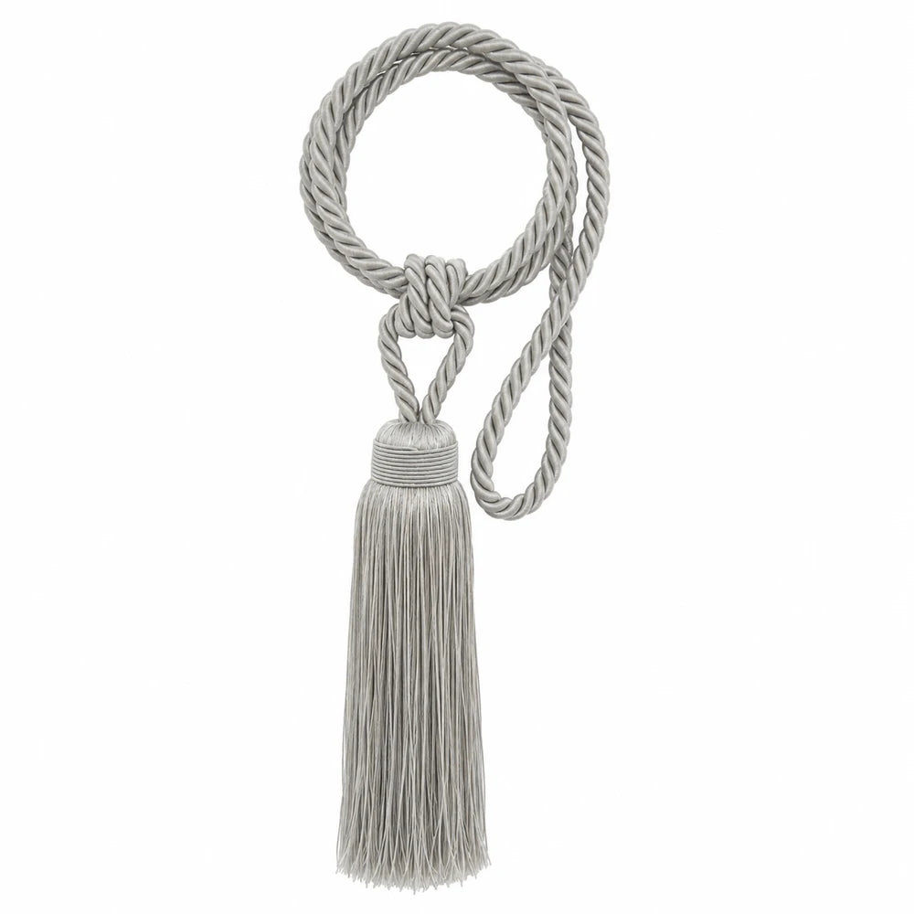 Curtain tieback made of twisted light gray rope with a knotted loop and a long fringe tassel for drapery.