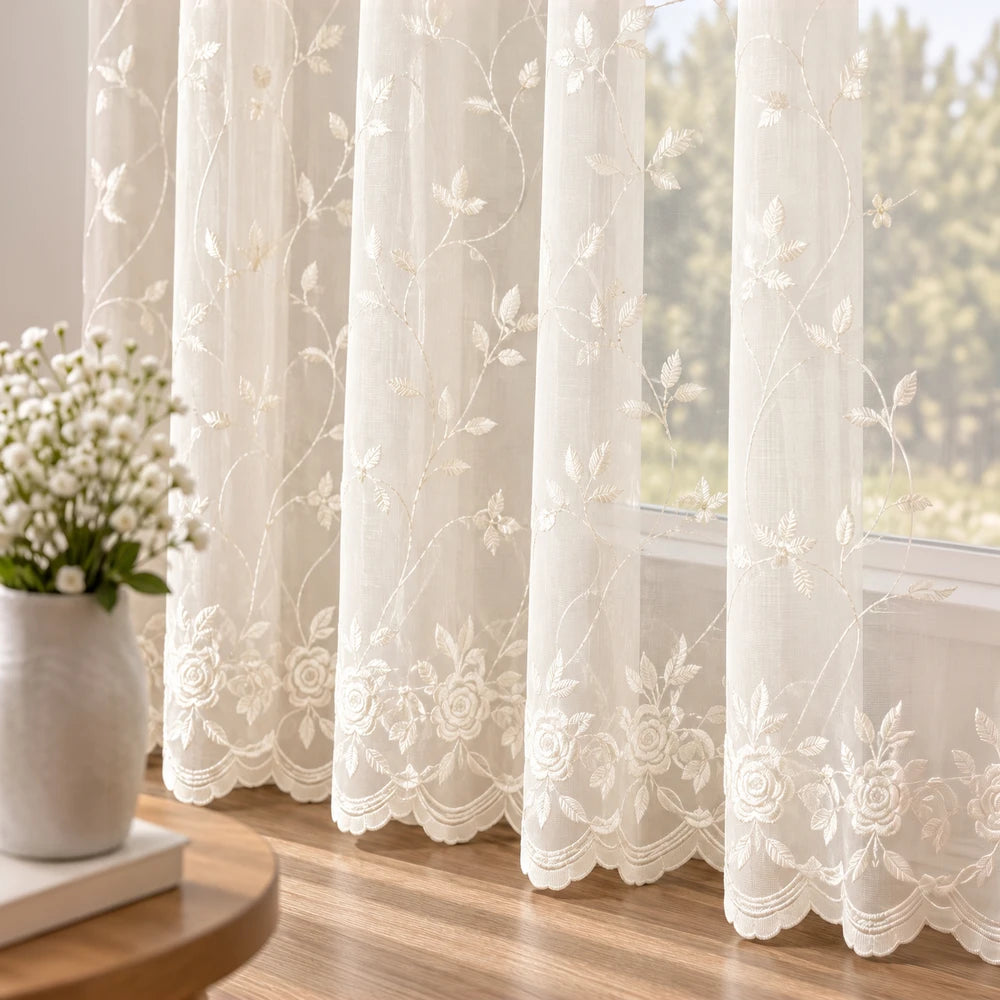 Embroidery On Plain Voile 5m Taped Curtain: sheer white voile with delicate floral embroidery and scalloped edge.