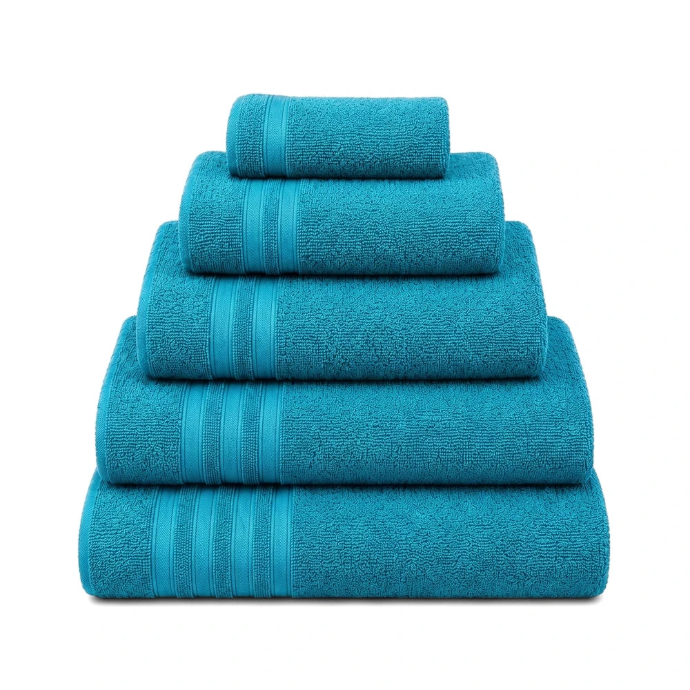 Stacked turquoise Everyday Towels in various sizes, neatly folded with a soft terry cloth texture.