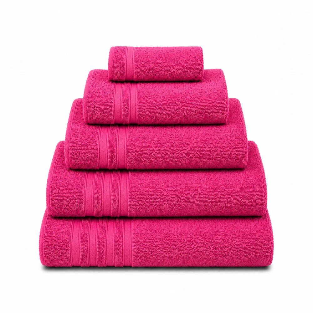 Everyday Towels in vibrant pink stacked from largest to smallest, showing plush cotton bath towels for everyday use.