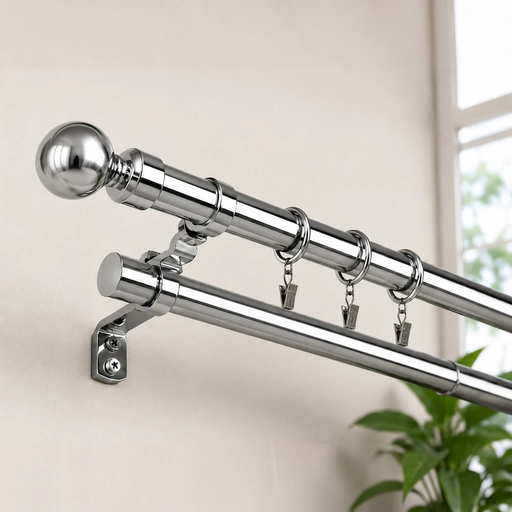 Extendable curtain rod 2.0-4.0m in polished chrome with wall mount bracket and clip rings for drapes.