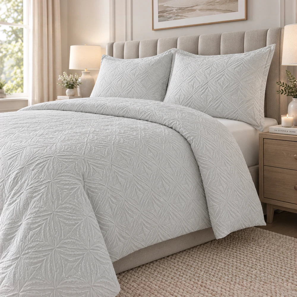 Horrockses 3D embossed palm Jumera duvet cover set in soft light grey with a textured palm leaf pattern on the duvet and