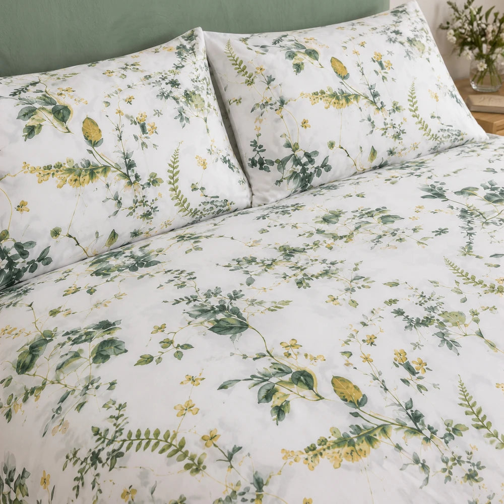 Horrockses Polycotton Duvet Cover - Cotta Leaves in white with green and yellow botanical leaf print.