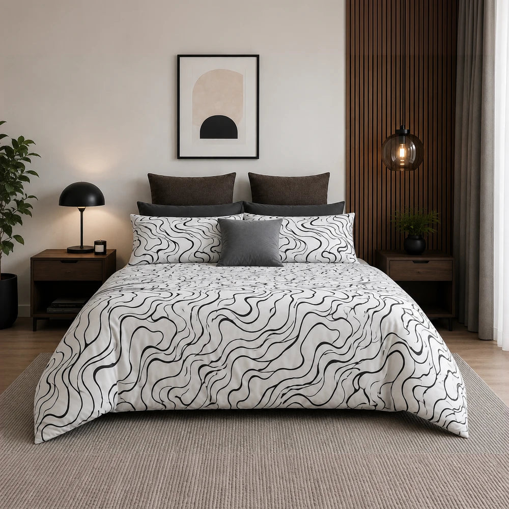 Horrockses Polycotton Duvet Cover Curve in white with a black wavy line pattern, styled on a neatly made bed.