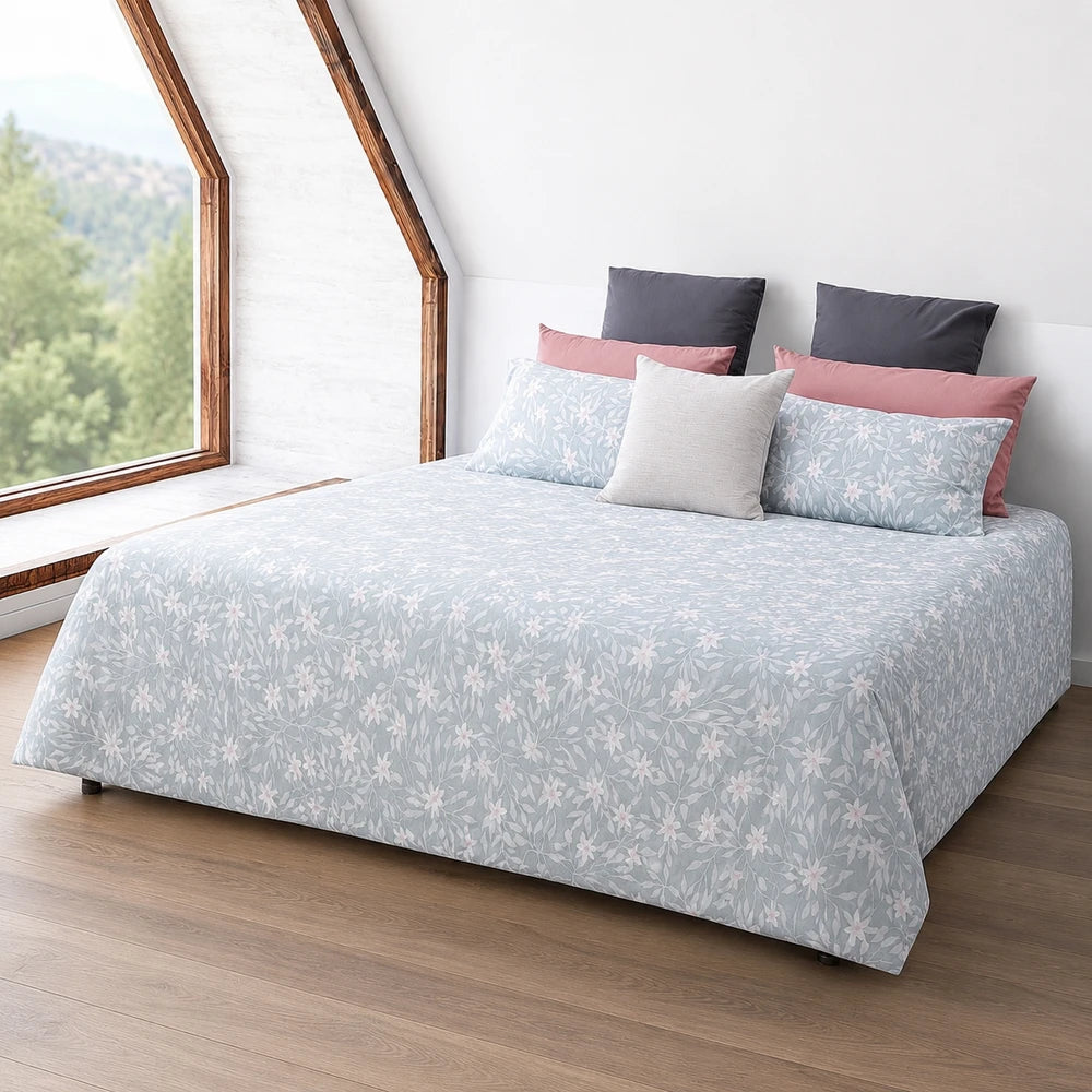 Horrockses polycotton duvet cover Nikita in a light blue floral pattern with complementary pink and gray cushions