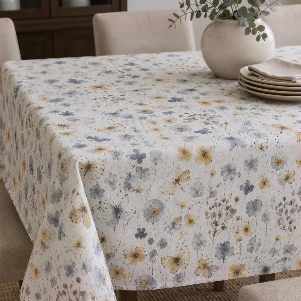 Linen Look Table Cloth with a soft beige background and blue-yellow floral pattern, providing a natural, casual dining