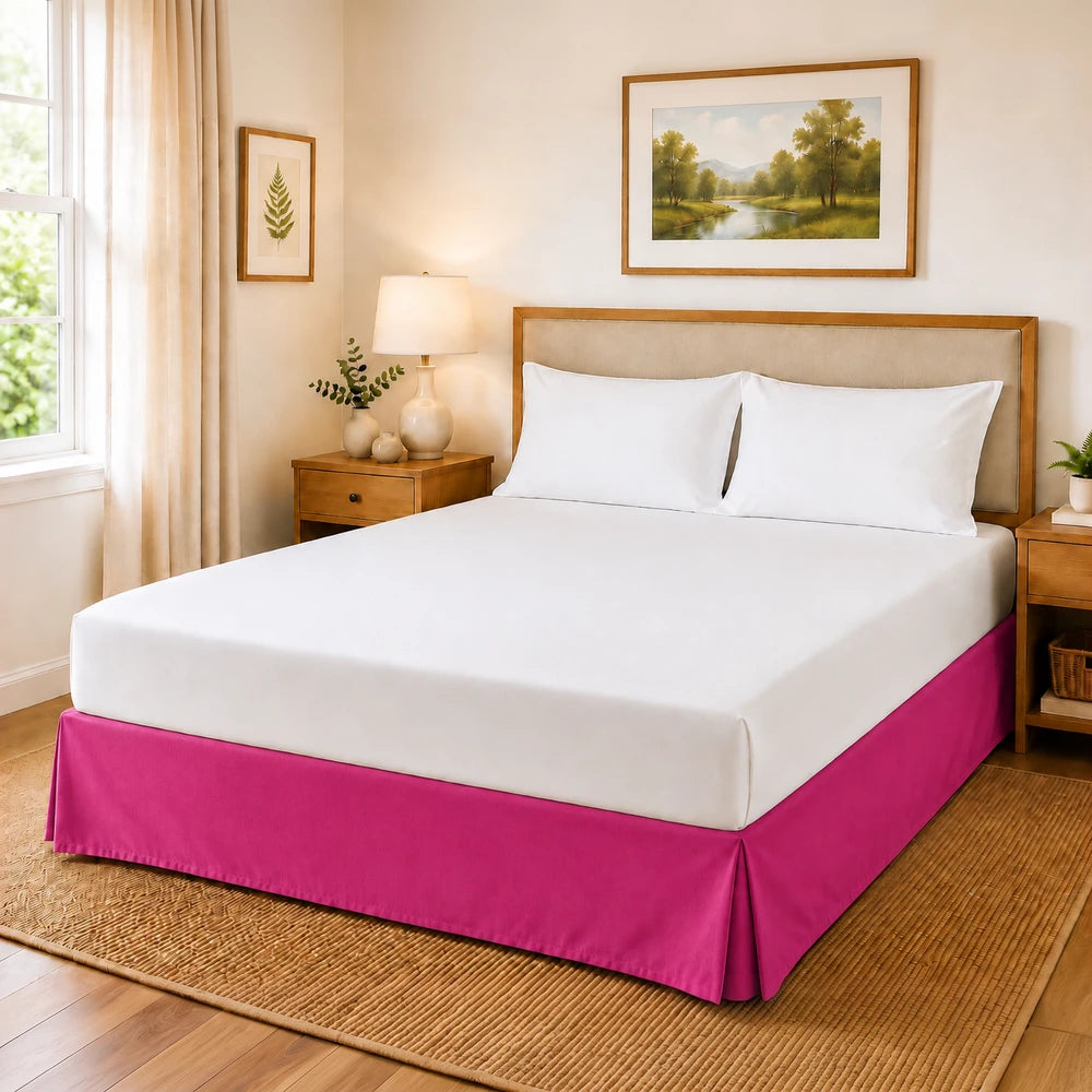 Microfibre base wrap in bright pink for a bed base, shown on a neatly made bed with white bedding and wooden nightstands.