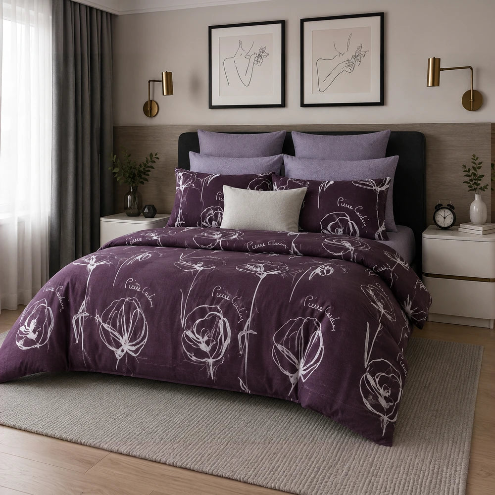 3 Piece Pierre Cardin Comforter set in deep plum with white floral sketches and purple pillow shams.