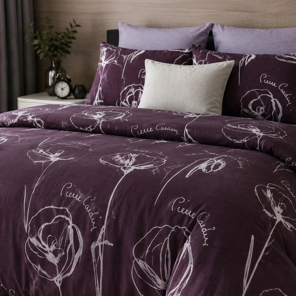 3 Piece Pierre Cardin Comforter set in deep purple with white floral line art pattern.