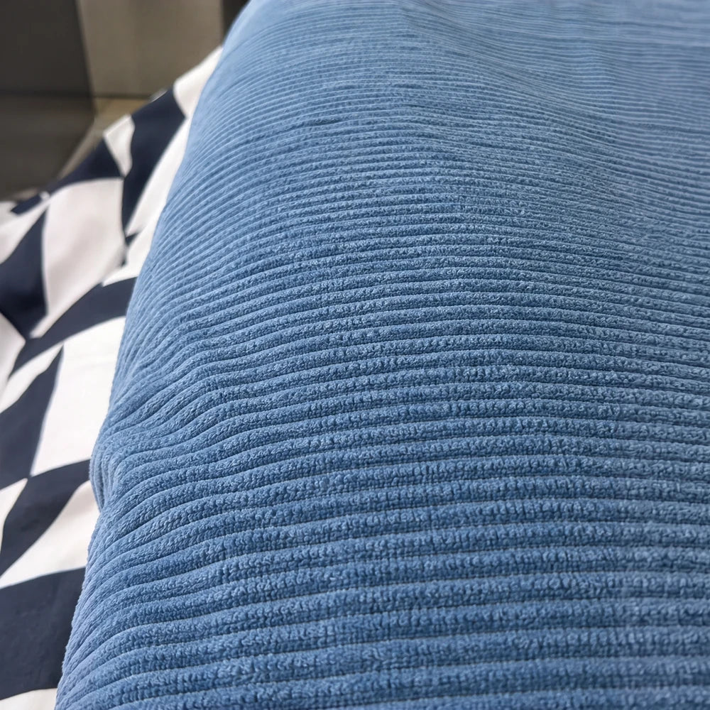 Pierre Cardin Corduroy Sherpa Throw in blue with corduroy ridged texture for cozy warmth and soft comfort.