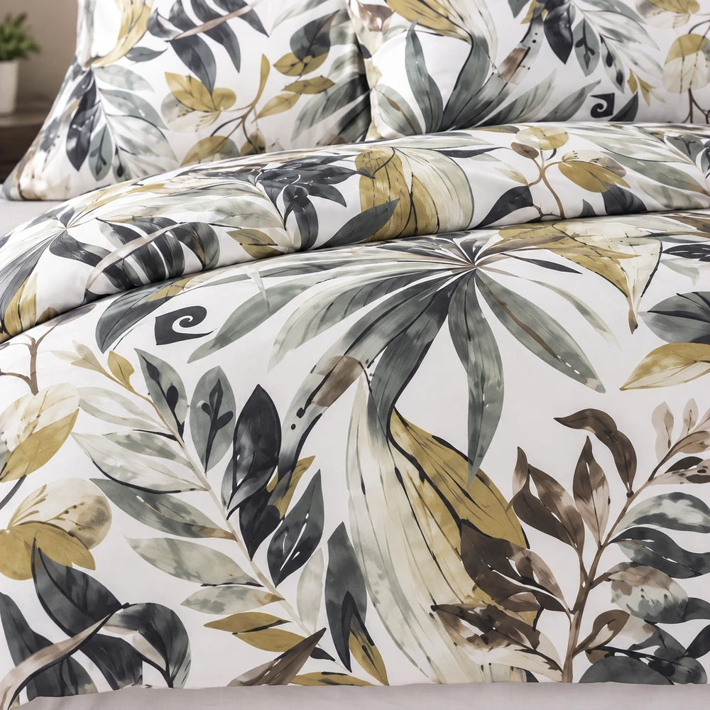 Pierre Cardin Duvet Cover Set Harmony Leaves featuring a botanical print in green, gray, and ochre on a white background,