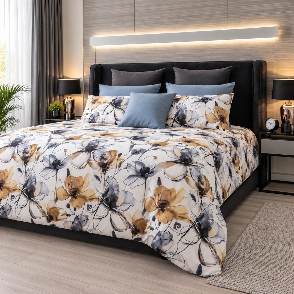 Pierre Cardin Duvet Cover Set Fiona Floral with blue and gold botanical pattern on a dark upholstered bed.