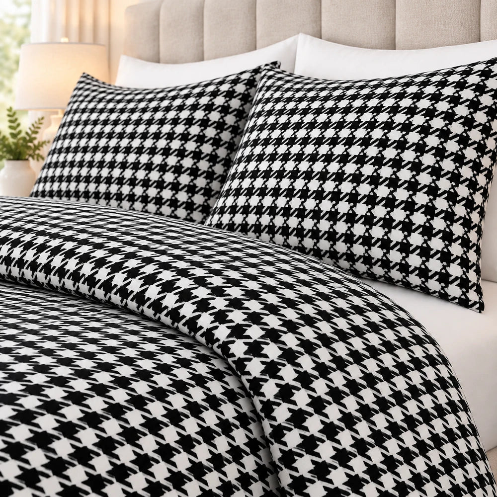 3Pc Pierre Cardin Printed Houndstooth Quilt set in black and white with matching pillow shams for a modern bedroom look.