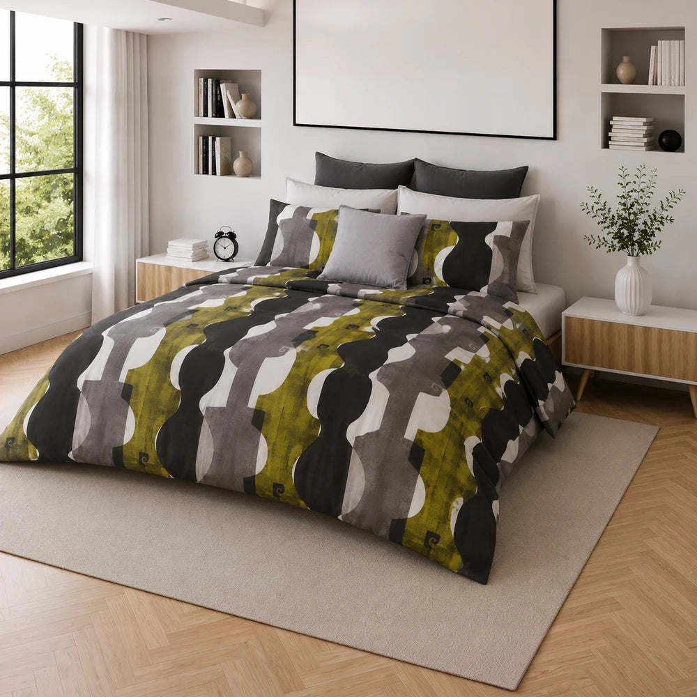 Pierre Cardin Microfibre Cover Set Branson on a neatly made bed with an olive, grey and black abstract pattern.