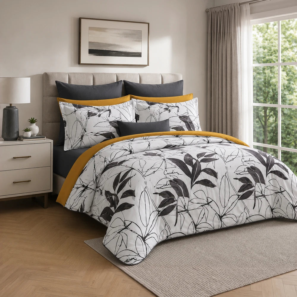 Pierre Cardin Microfibre Duvet Cover Set in Botanist Leaf with white background, black botanical print and mustard-yellow
