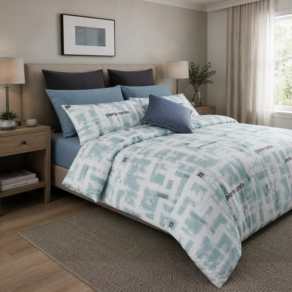 Pierre Cardin microfibre duvet cover set in teal-blue Geo Brushstroke pattern with coordinating light blue pillow shams.