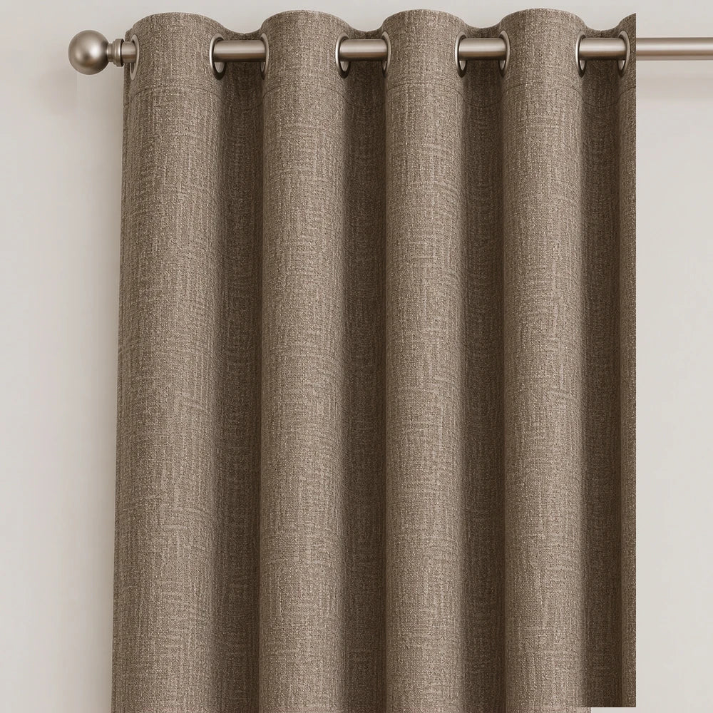 Pierre Cardin microlinen eyelet lined curtain in taupe-brown fabric with metal grommets, showing a textured linen weave.