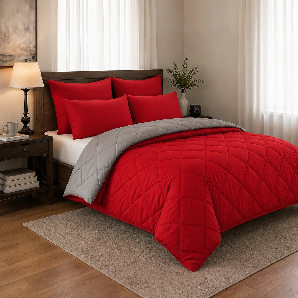 5Pc Pierre Cardin Monochrome Reversible Comforter set in red and gray, shown on a neatly made bed with matching red pillows.