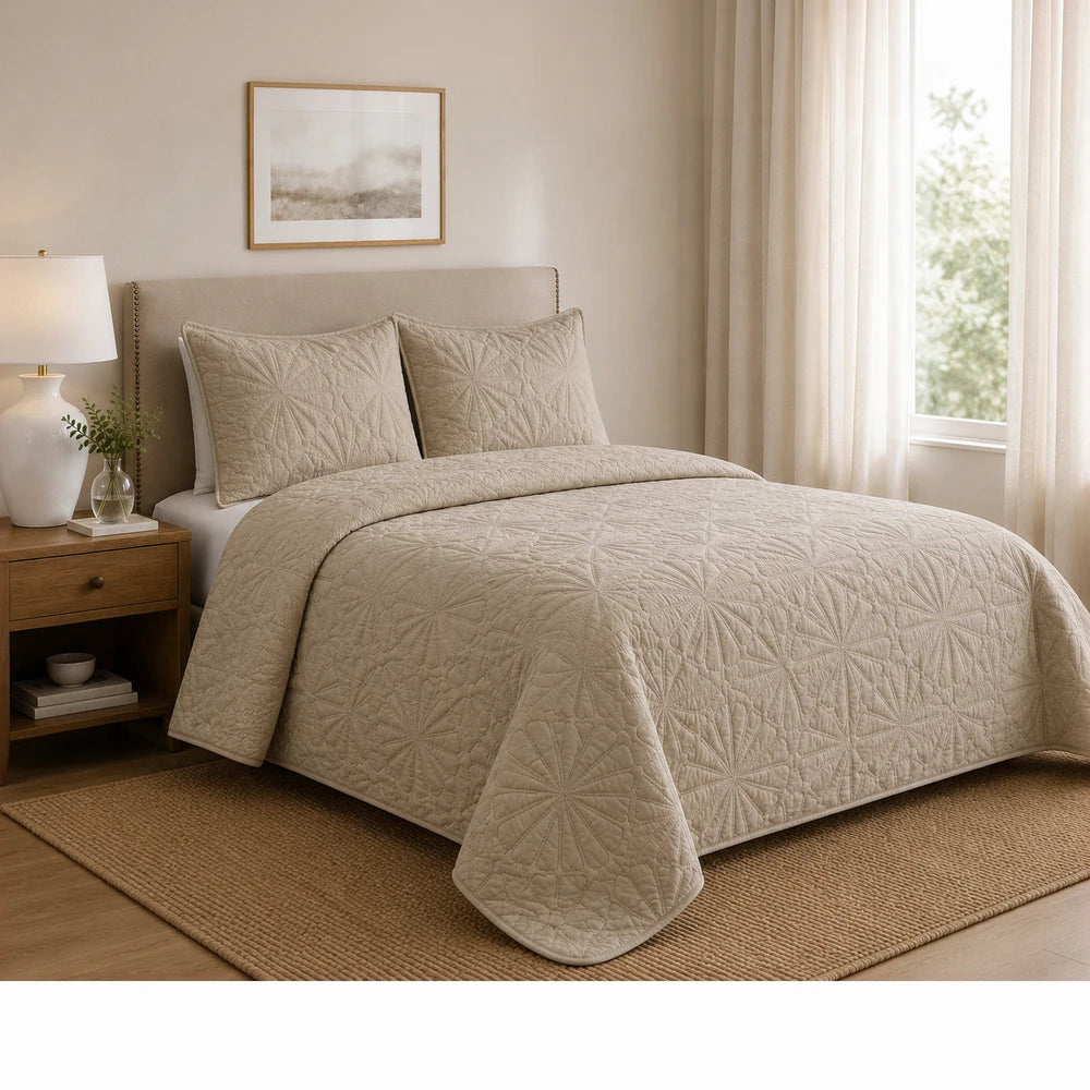 3Pc Pierre Cardin Pinsonic Quilt in beige with a quilted geometric pattern and matching shams on a neatly made bed.