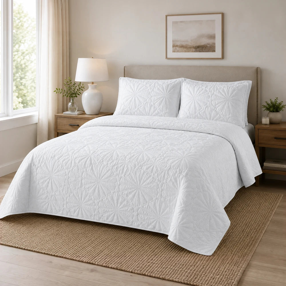3Pc Pierre Cardin Pinsonic Quilt in white with a geometric quilted pattern on a neatly made bed.