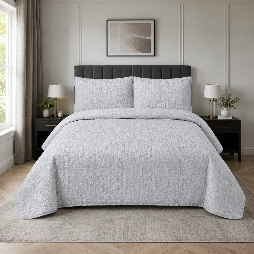 Pierre Cardin 3pc Textured Pinsonic Quilt set in light grey with matching shams, adds subtle texture to a modern bedroom.