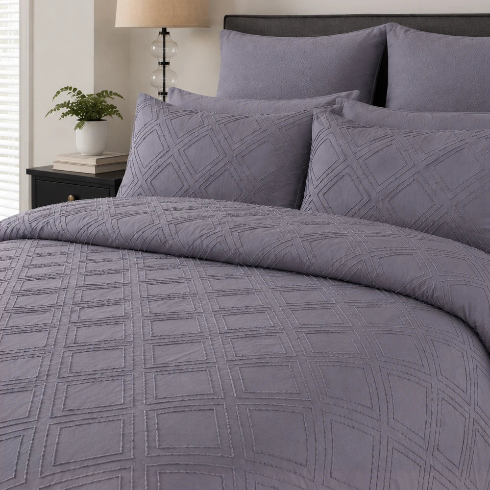 Pierre Cardin Trufted Stripe Duvet Cover in lavender with geometric tufted square pattern; includes matching pillow shams.