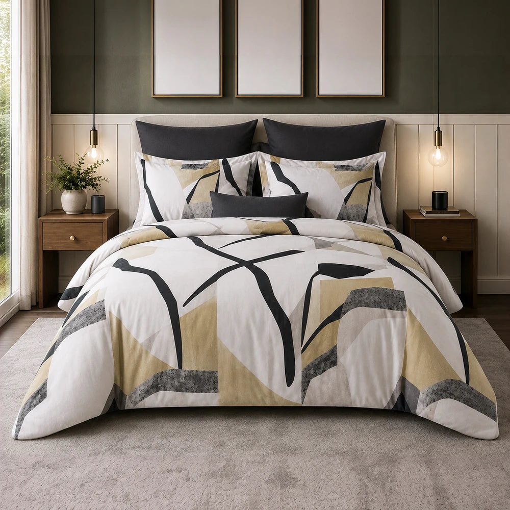 Pierre Cardin Vogue Duvet Cover Set with Artisan Leaf pattern in beige, black and white on bed, includes coordinating shams
