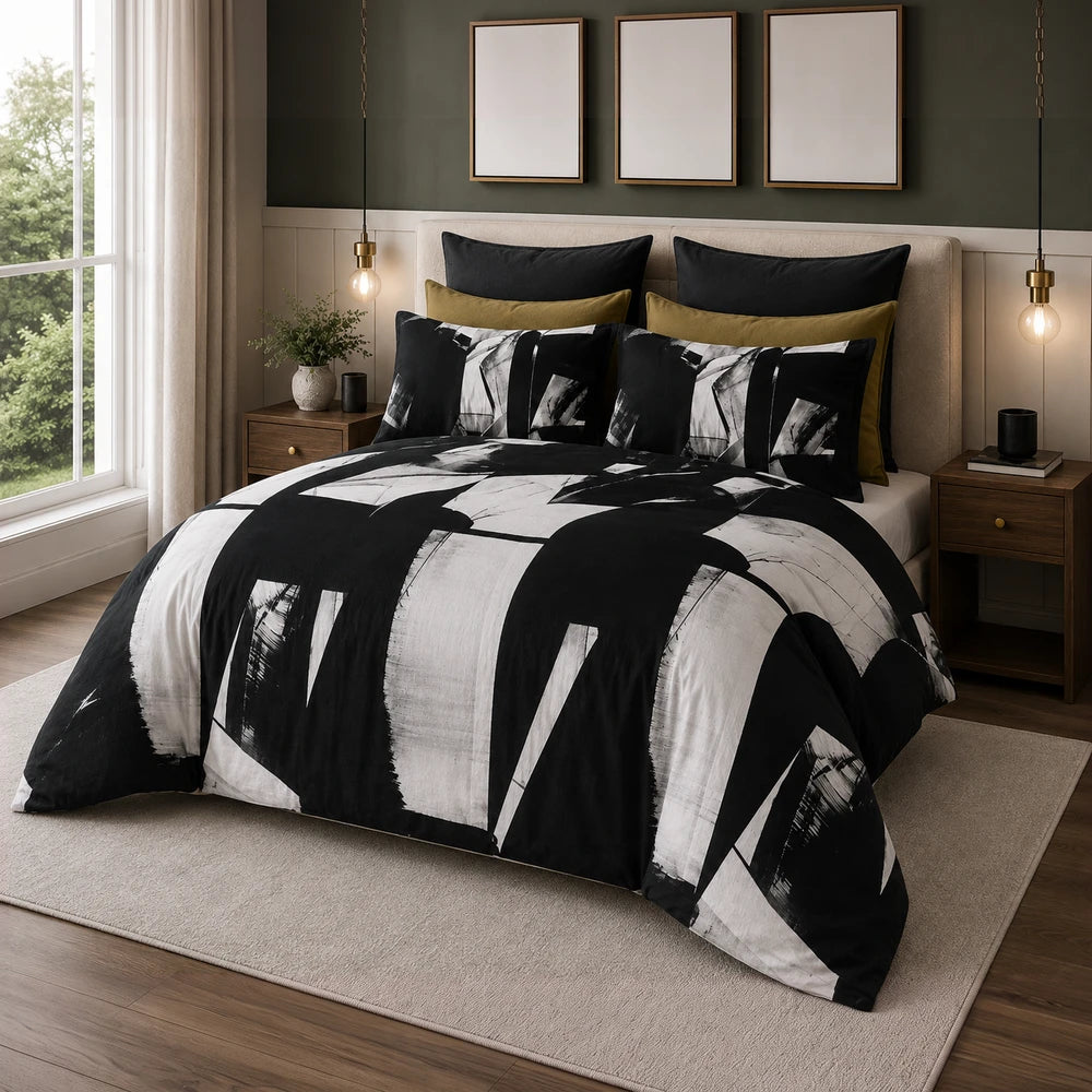 Pierre Cardin Vogue duvet cover set in a black and white abstract pattern with coordinating sham pillows and mustard accent