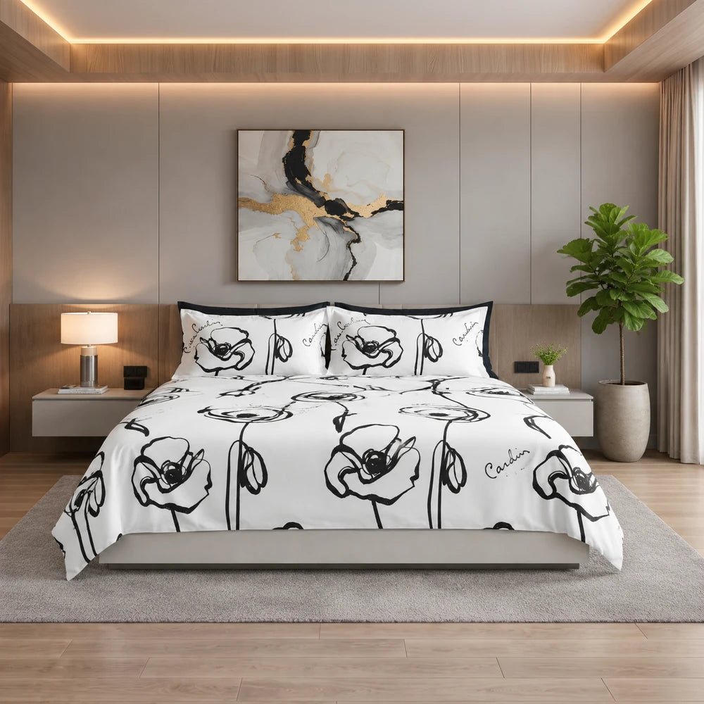 Pierre Cardin Vogue Duvet Cover Set Contempo Bloom: white duvet cover with black floral line art on a neatly made bed in a