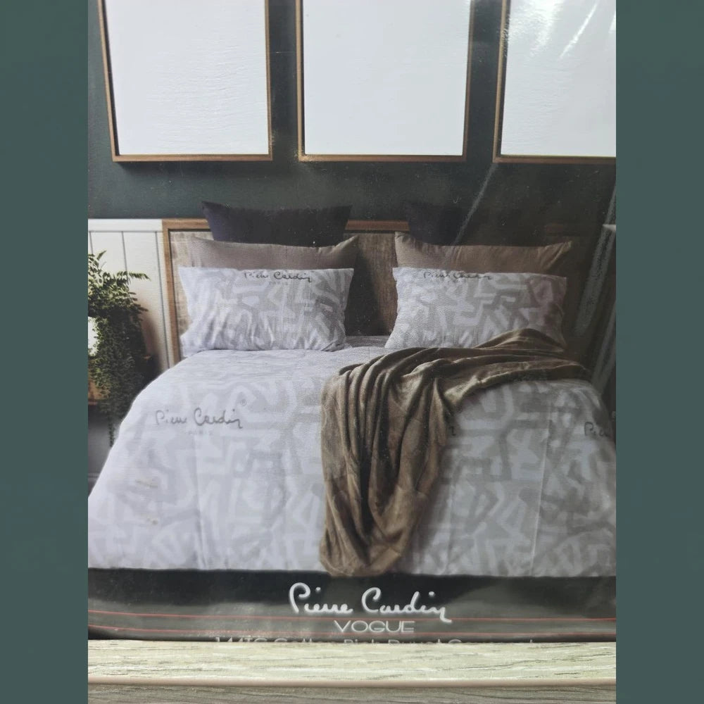 Pierre Cardin Vogue Duvet Cover Set Jada in white with a subtle gray geometric pattern and matching pillowcases.