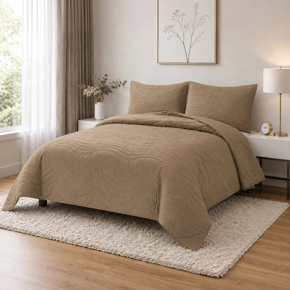 Premium Carducci wave pattern 100% cotton quilt in beige on a neatly made bed with matching pillows