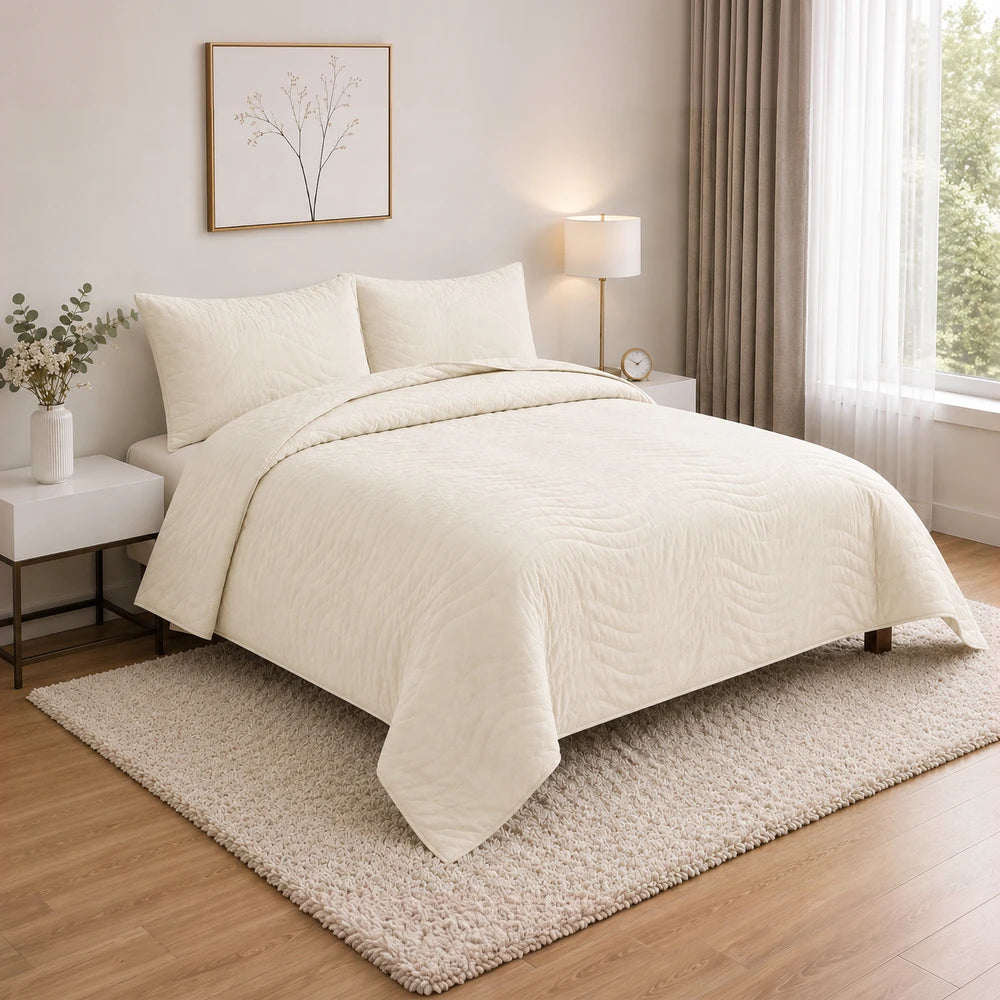 Premium Carducci Wave Pattern 100% Cotton Quilt in ivory, neatly draped on a neutral bedroom bed.