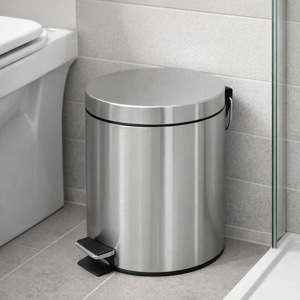 Premium stainless steel 5L step-pedal trash bin with a foot pedal and lid, sleek bathroom waste container.