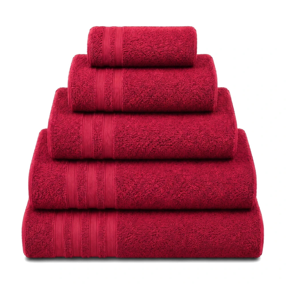 Stacked red everyday towels, made from soft, absorbent fabric, neatly arranged in a pyramid shape for display.